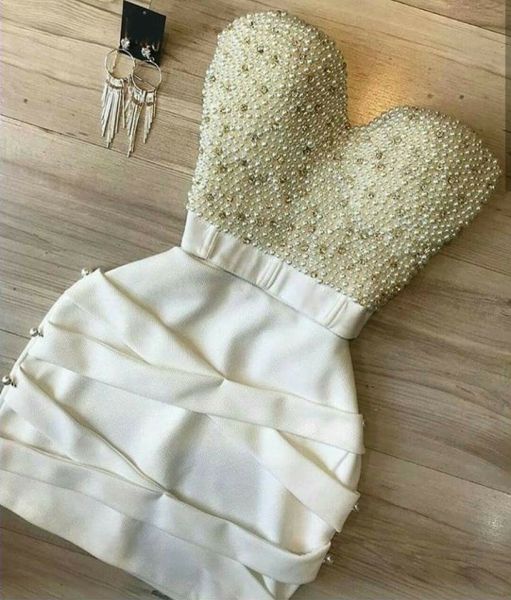 Conjunto Top Cropped  Tomara que Caia Bordado em Pérolas e Saia Detalhe X